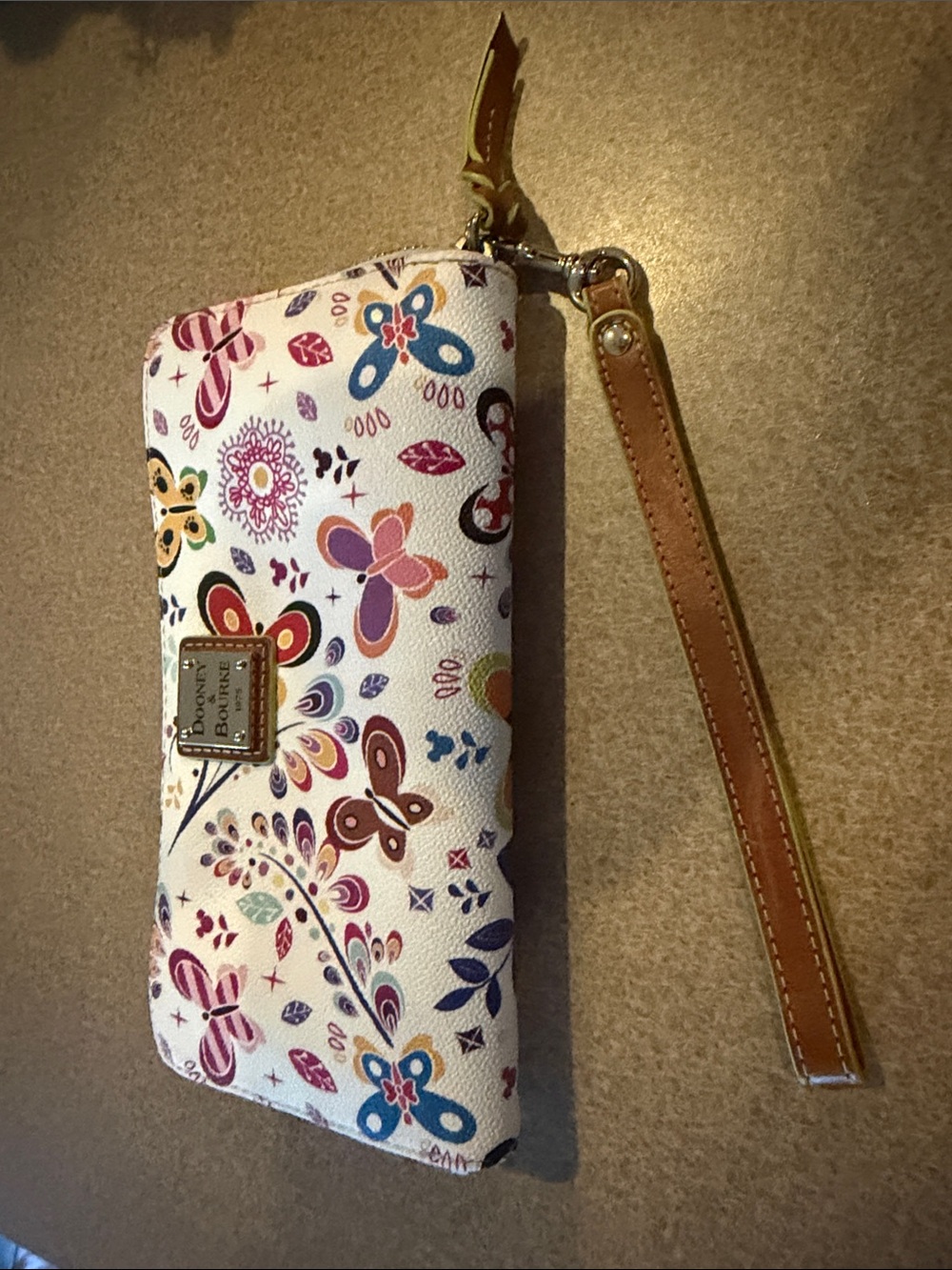 Dooney & Bourke White Floral Butterfly Wristlet with Tan Strap
